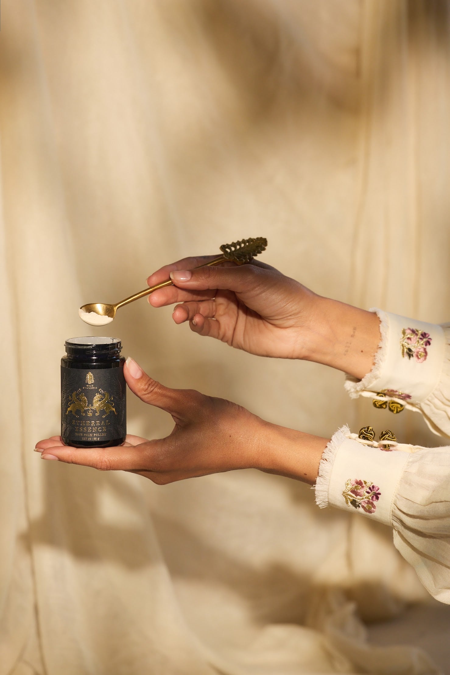 Person holding a spoon with Ethereal Essence.